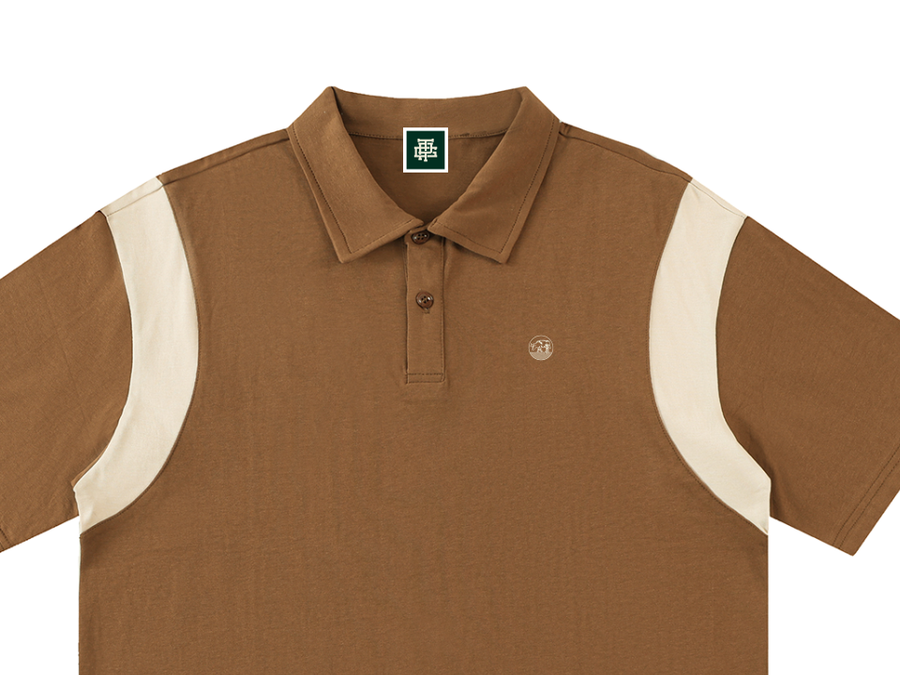 Dogleg in Brown with Cream, with the round cow badge
