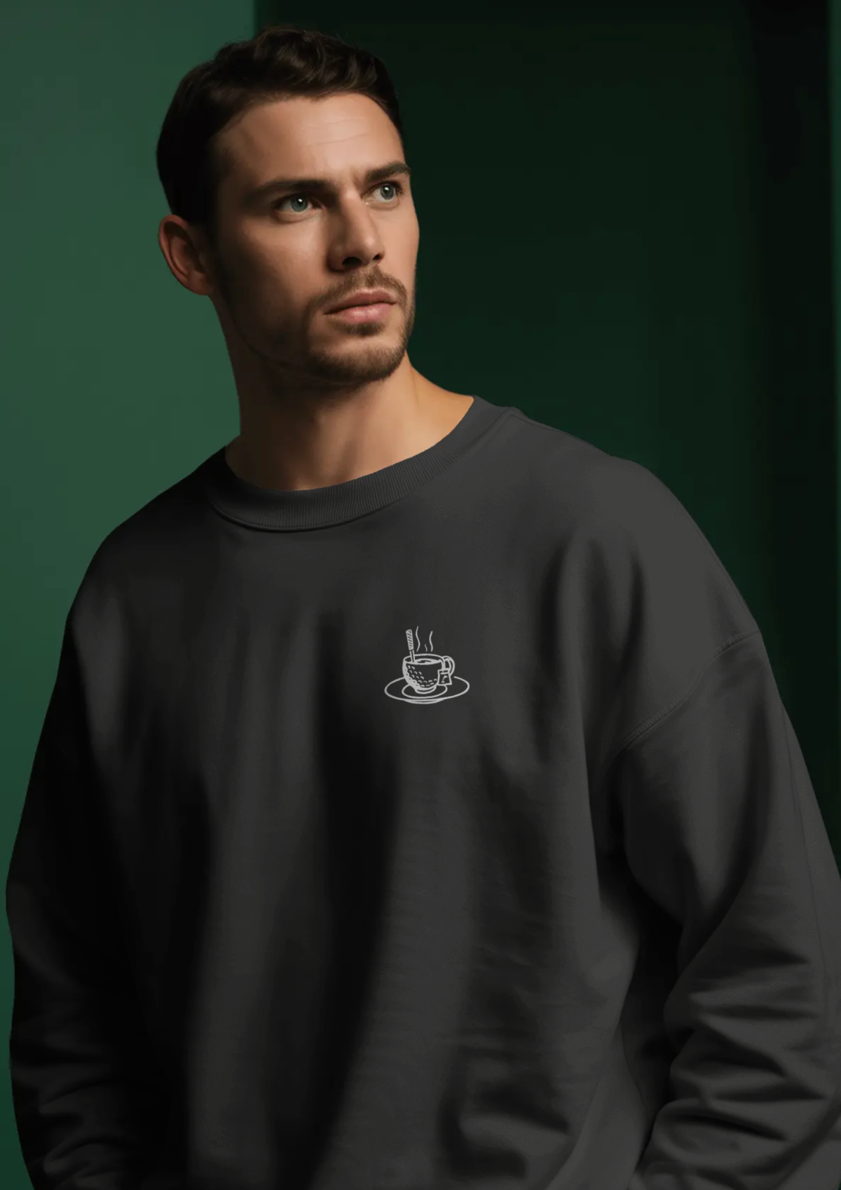 Man wearing the Tee Time golf sweatshirt in Black, with the teacup print on the chest