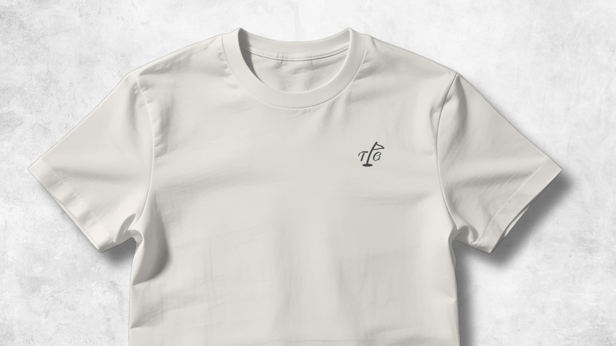 Off-white Three Putt Golf T-shirt with a small TPG flagstick logo on the chest