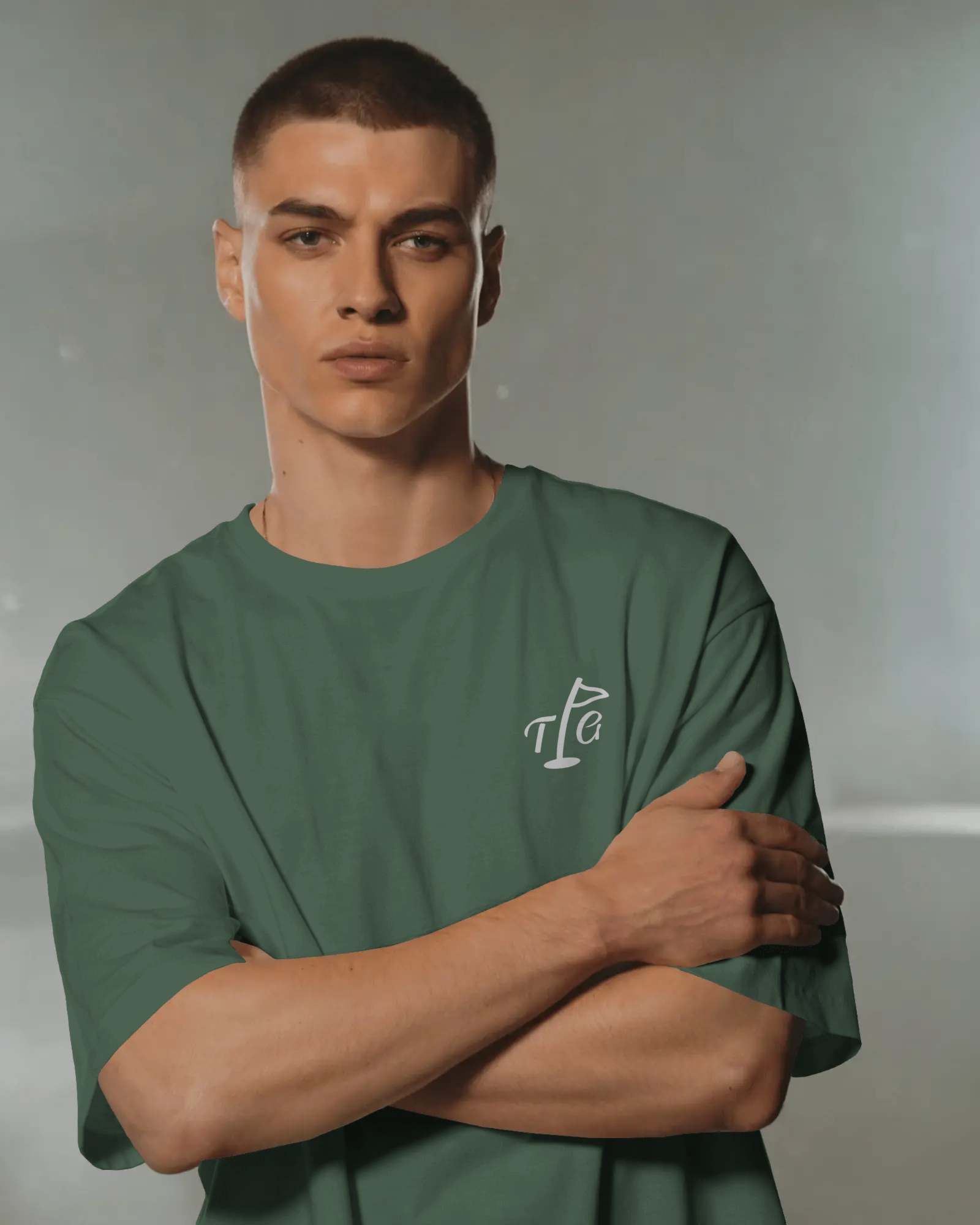Male model standing in Three Putt Golf Streetwear T-Shirt in Green, relaxed fit