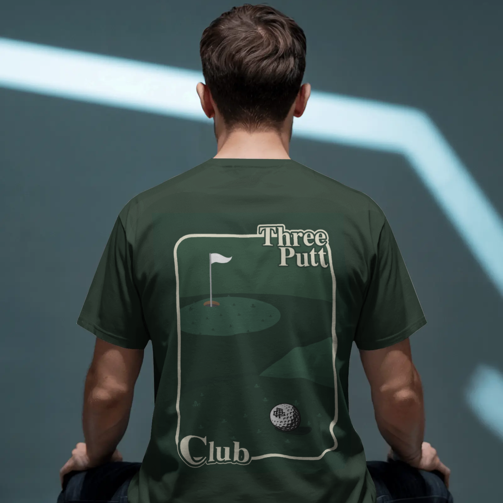 Person wearing a green t-shirt with a golf-themed design and text.