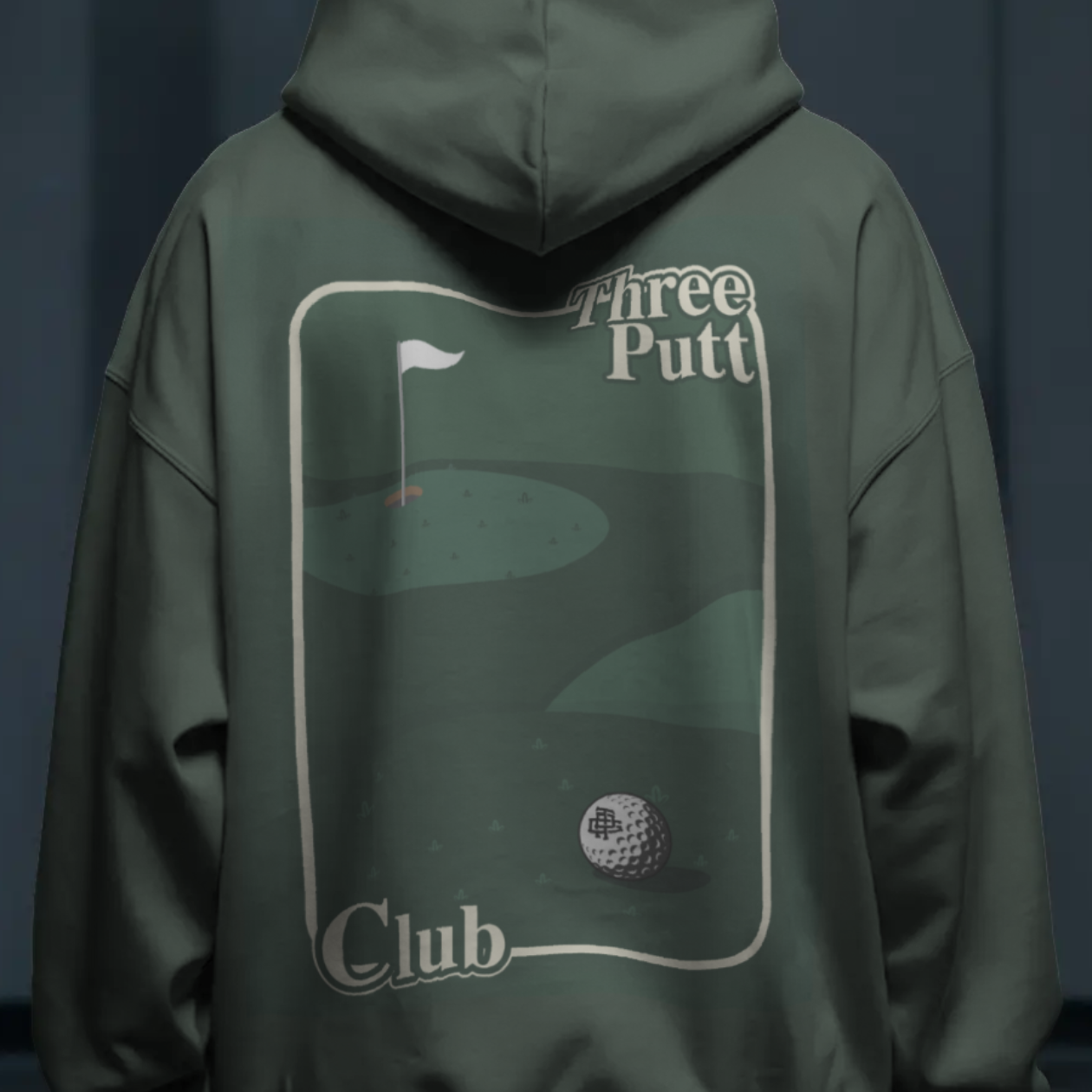 Green hoodie with 'Three Putt Club' logo on the back against a dark background