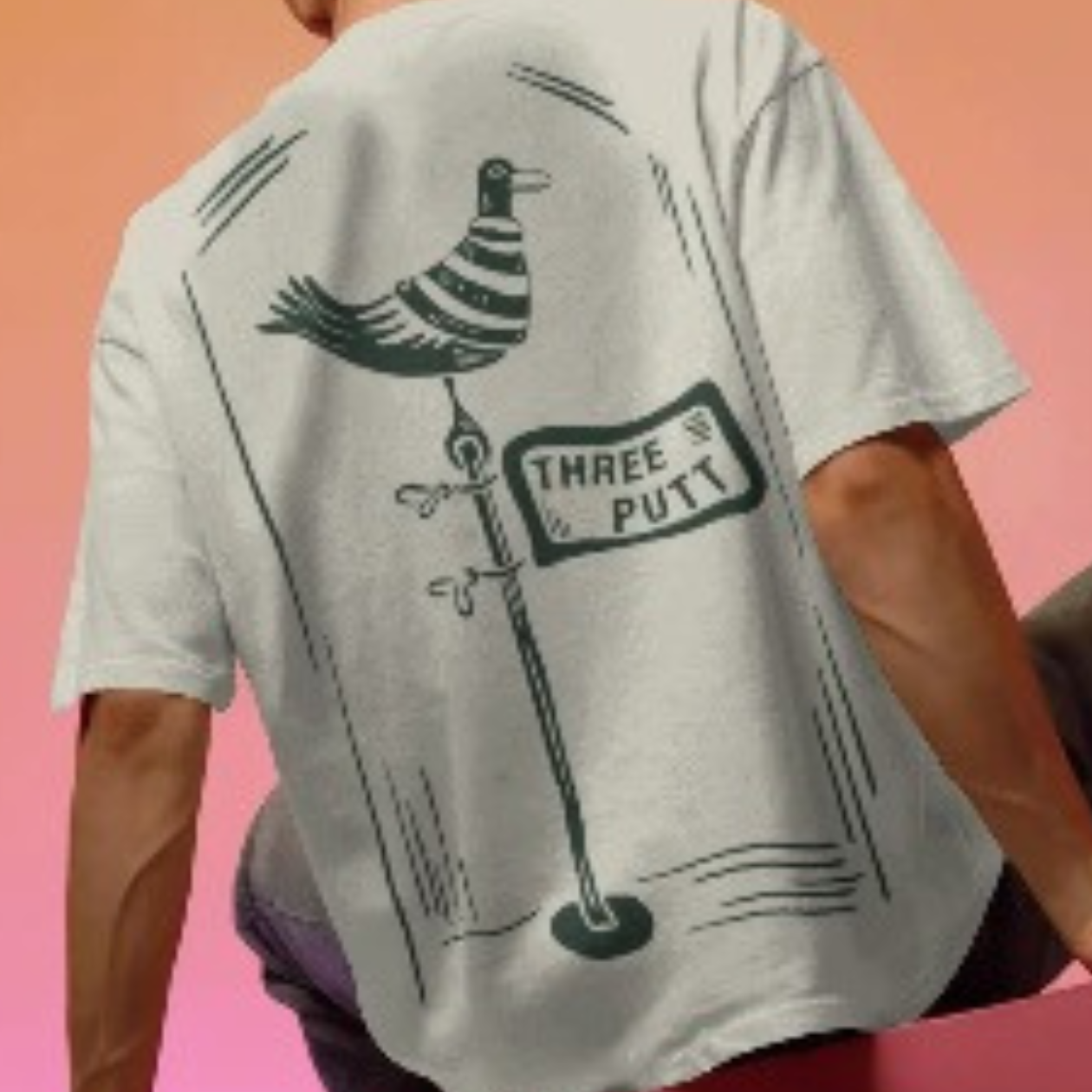 Person wearing a white t-shirt with a graphic design on the back against a gradient background