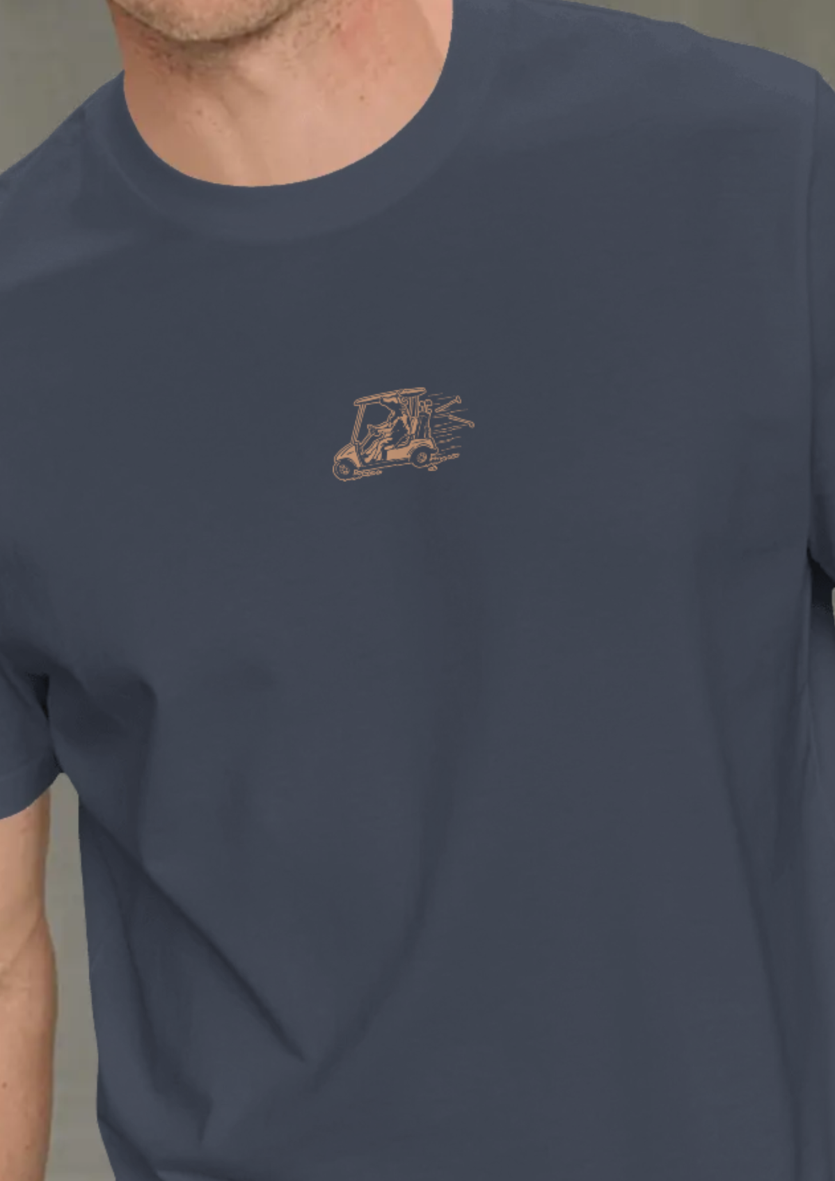 Man wearing the Reckless Driving golf T-shirt in Navy, with the cow-and-golf-cart print on the chest