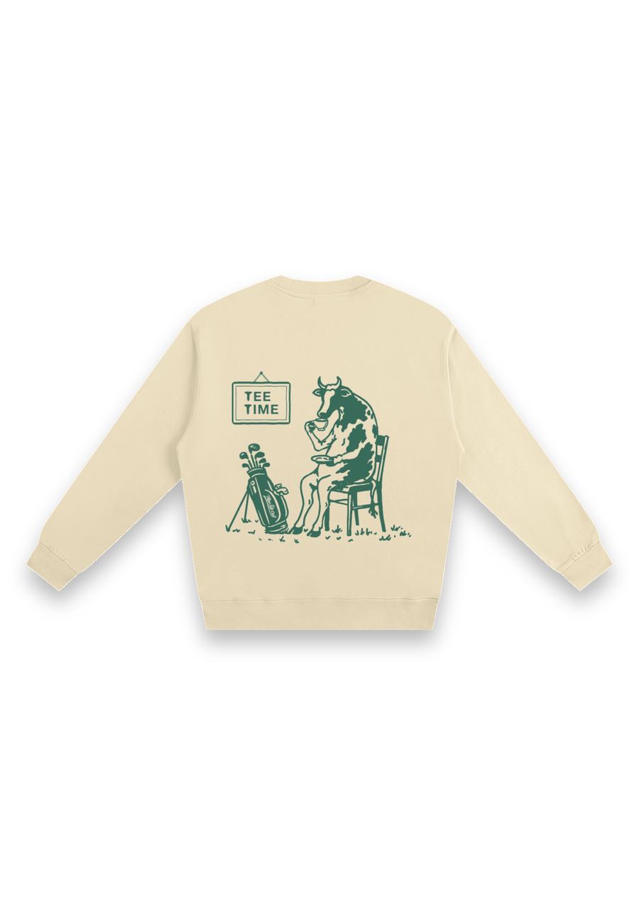 Tee Time golf sweatshirt in Cream, back view showing the cow having a cup of tea beside its clubs under the Tee Time sign